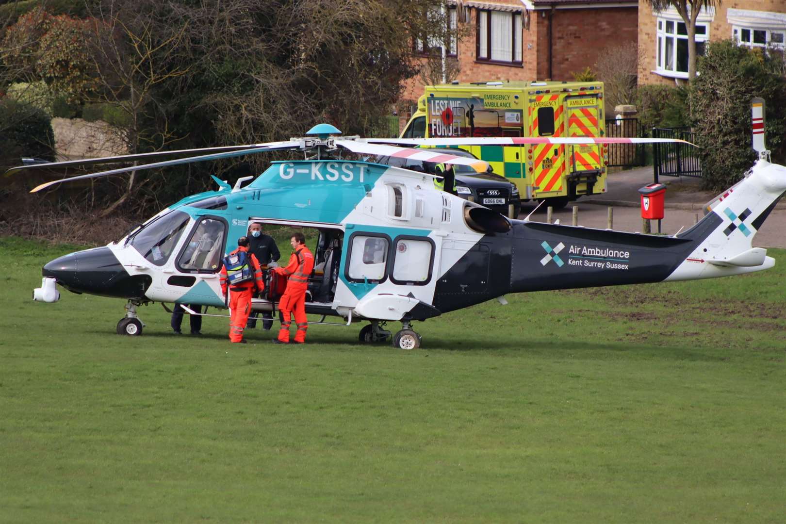 Medical crew getting into the Kent Surrey and Sussex air ambulance at The Glen, Minster, Sheppey