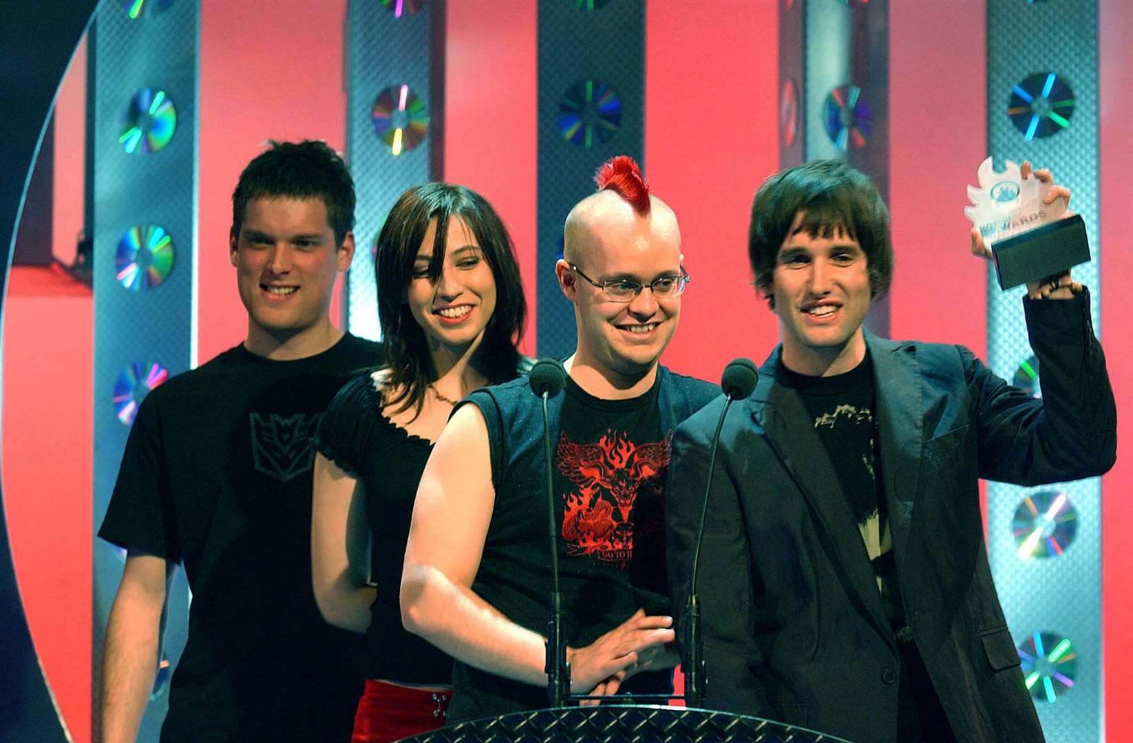 Ash receive their award for Best Irish Album at the Hot Press Awards in Belfast, in 2002 (PA)