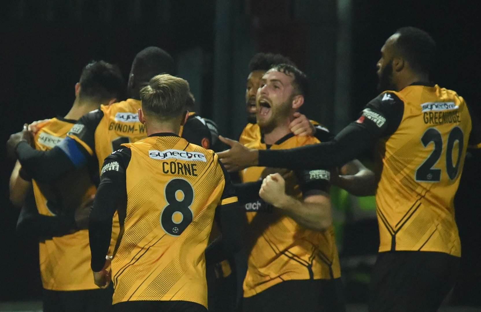 George Fowler, second from right, joins the celebrations after Jack Barham's opener at Scunthorpe. Picture: Steve Terrell