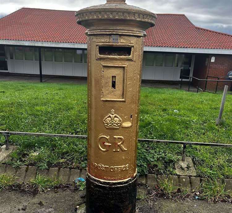 A postbox painted gold in Watling Street in Dartford