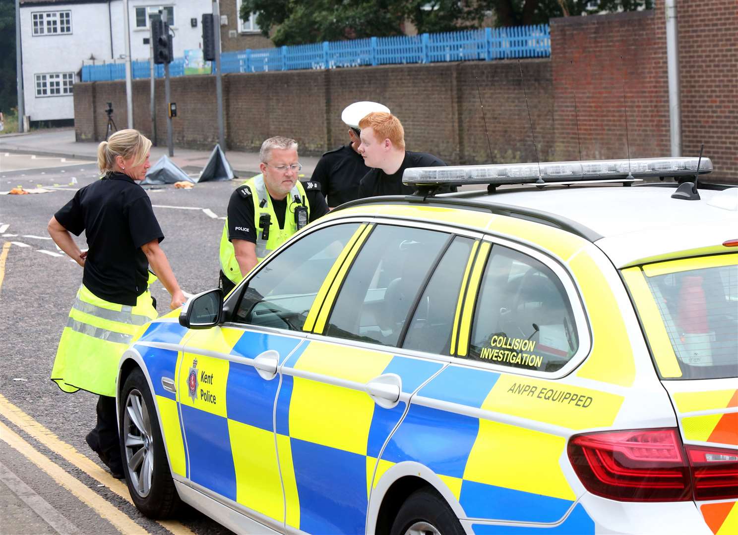 Police at the scene of a crash in New Road, Chatham. Images: UKNiP