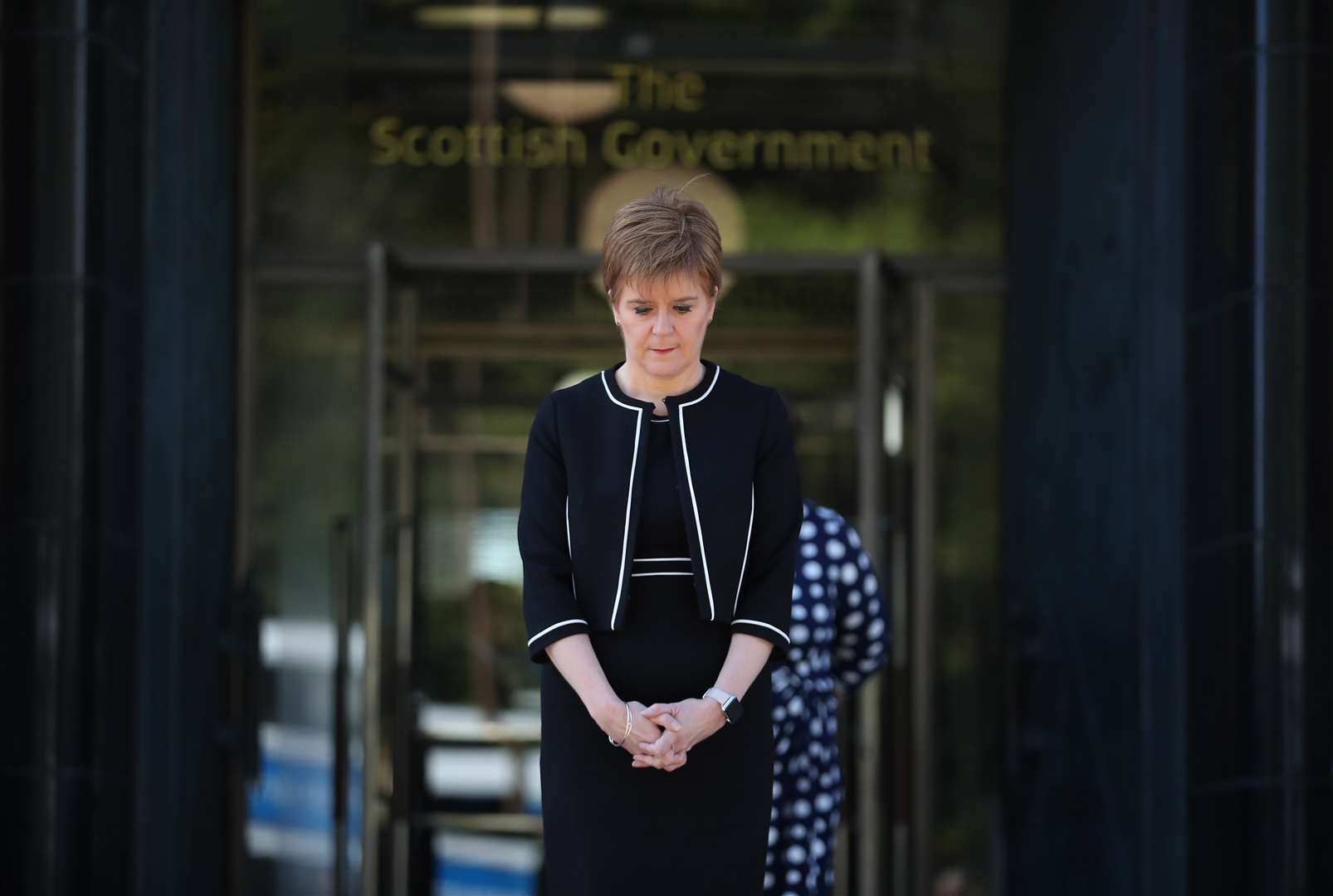 Scotland’s First Minister Nicola Sturgeon stood outside St Andrew’s House in Edinburgh to observe the silence (Jane Barlow/PA)