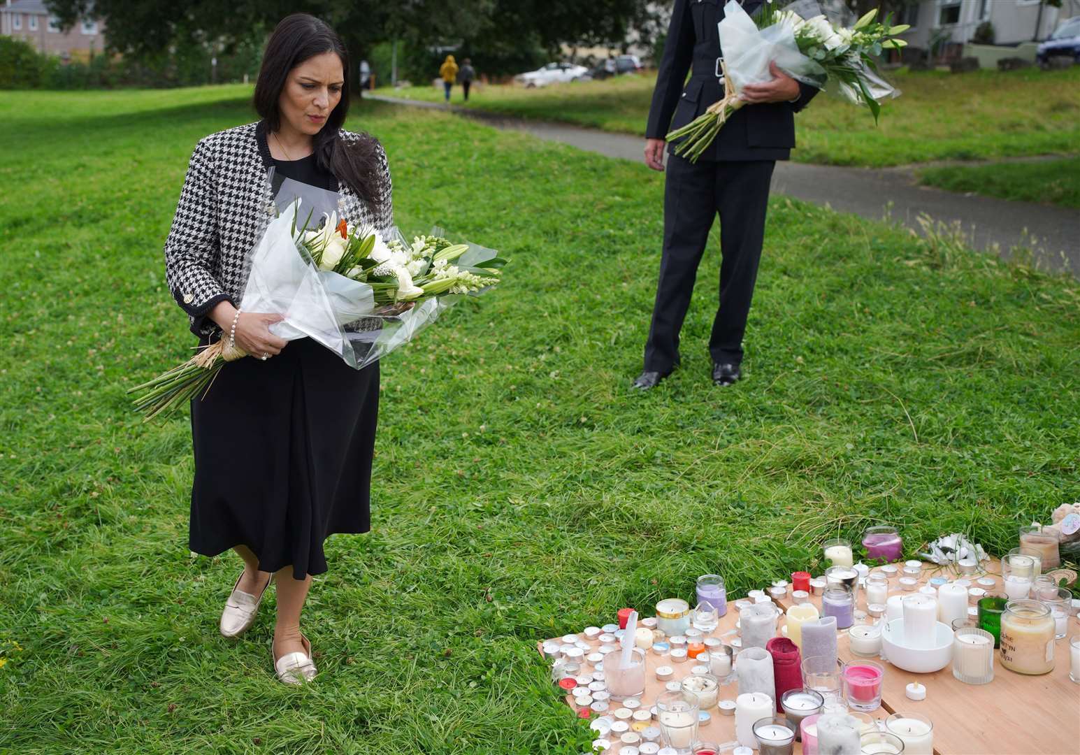 Home Secretary Priti Patel lays a bouquet of flowers in Plymouth, Devon (Ben Birchall/PA)