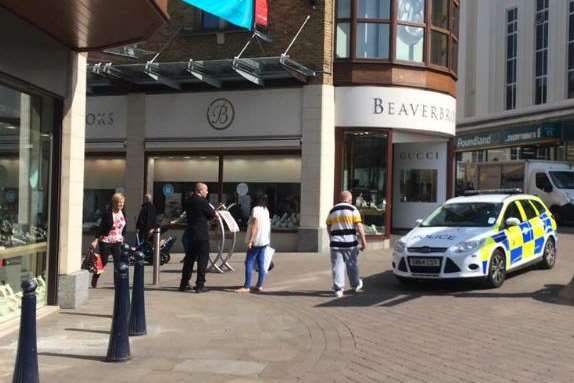 Police at the entrance of Fremlin Walk, which has a number of jewellery shops