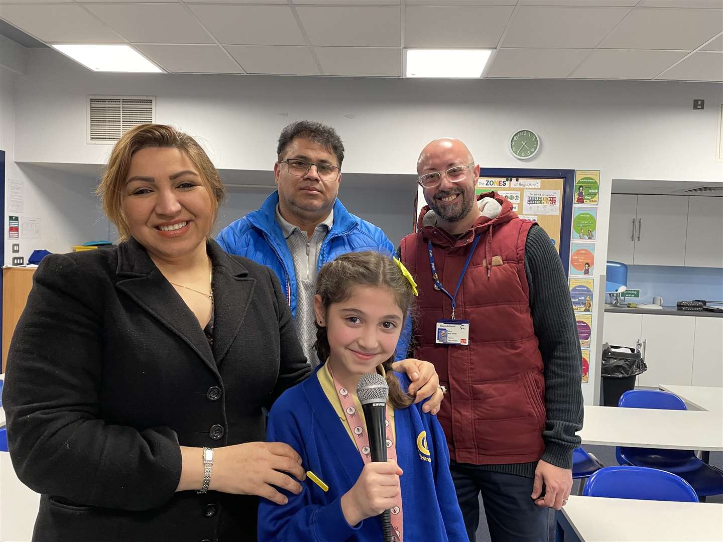 From left: Mum Mahanz Hajipour, dad Majid Rajabalinia, Eliza and teacher Robert Dymott