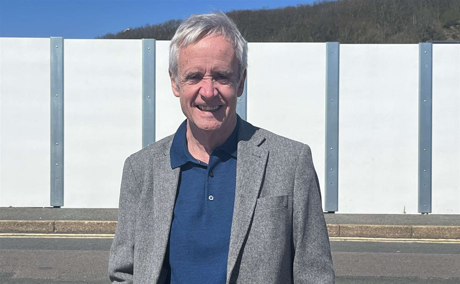 Cllr Jim Martin (Green) has been in charge of Folkestone and Hythe District Council since May 2023; he’s pictured by the hoardings at Princes Parade in Hythe which were taken down earlier this year