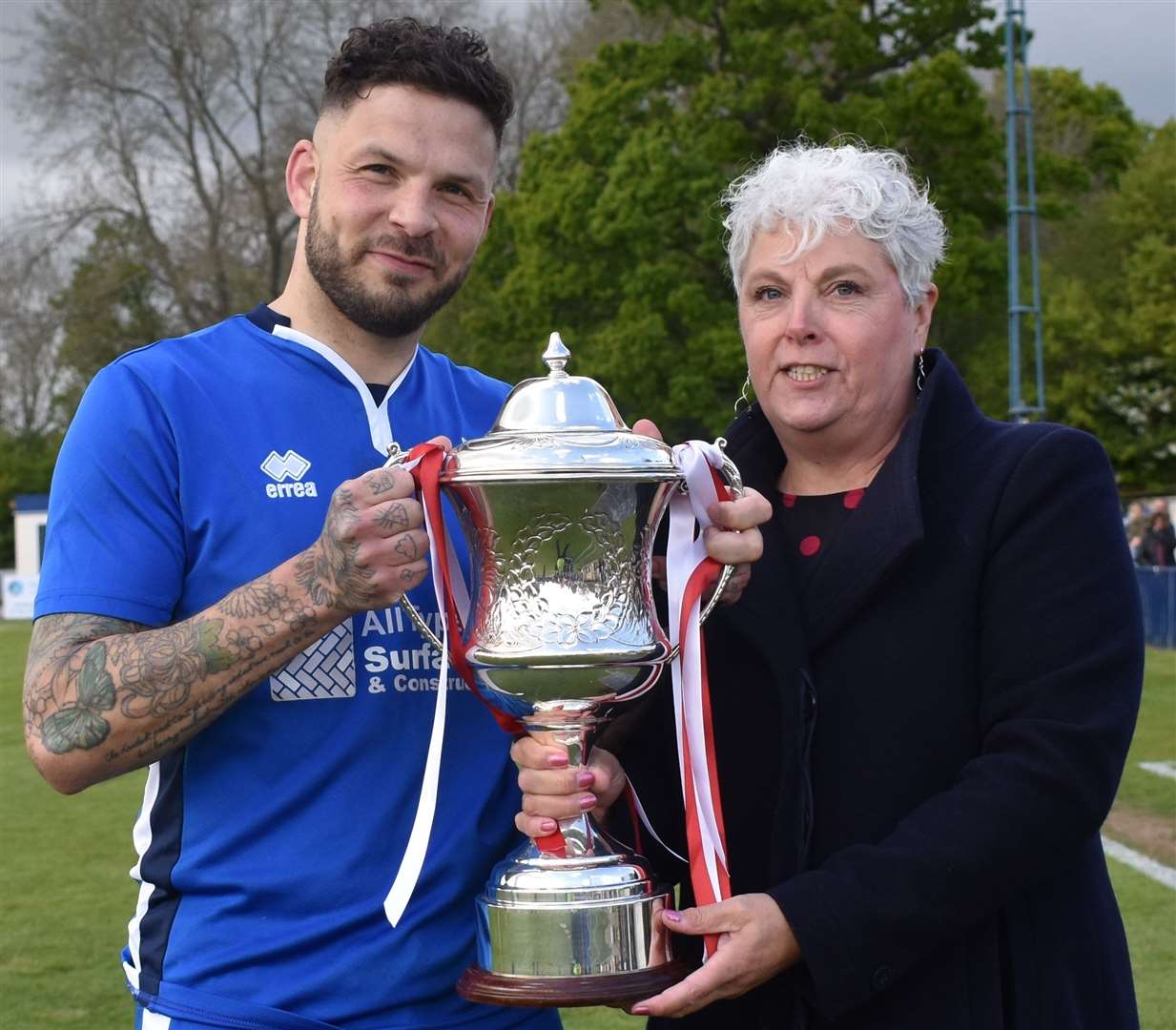 Chatham skipper Paul Vines receives the trophy from SCEFL chairman Denise Richmond. Picture: Alan Coomes