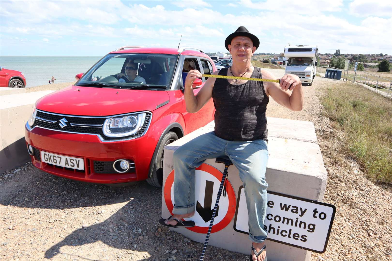 Ted Moody and his tape measure on one of the bollards on the shingle bank at Minster, Sheppey. Picture: John Nurden (40978316)