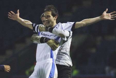 Jubilant Wycombe skipper Roger Johnson celebrates the win with keeper Ian Turner. Picture: ANDY PAYTON