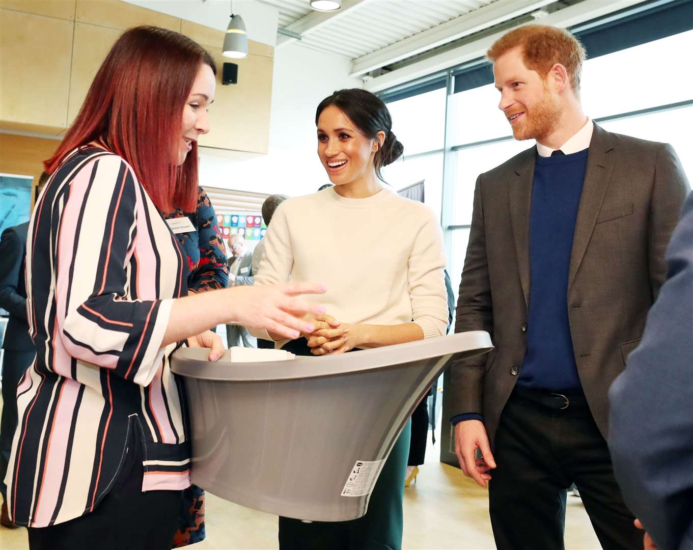 Harry and Meghan look at a baby bath during a visit to Catalyst Inc science park in Belfast (Niall Carson/PA)