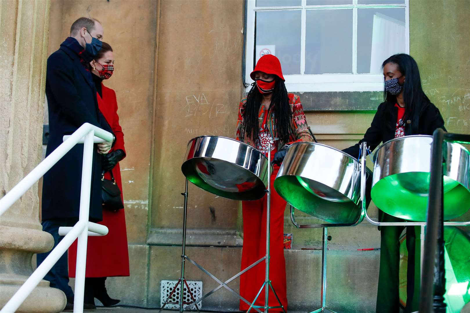 The Cambridges listen to members of the Reading All Steel Percussion Orchestra (Matthew Childs/PA)