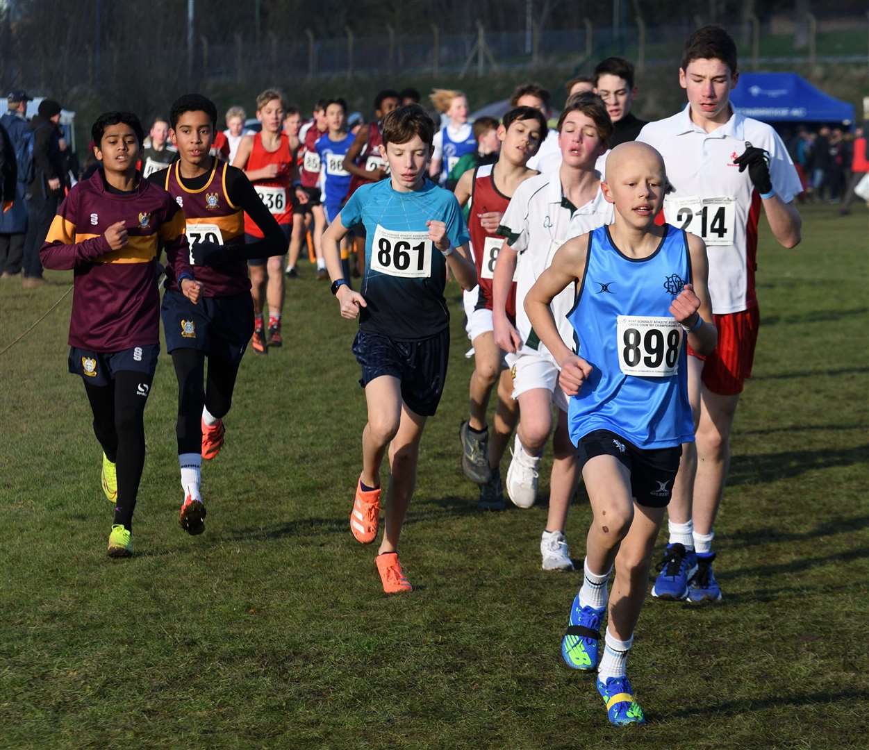 Tunbridge Wells' Herbert Phillips (No.898) hits his stride in the junior boys' race. Picture: Simon Hildrew (62006616)