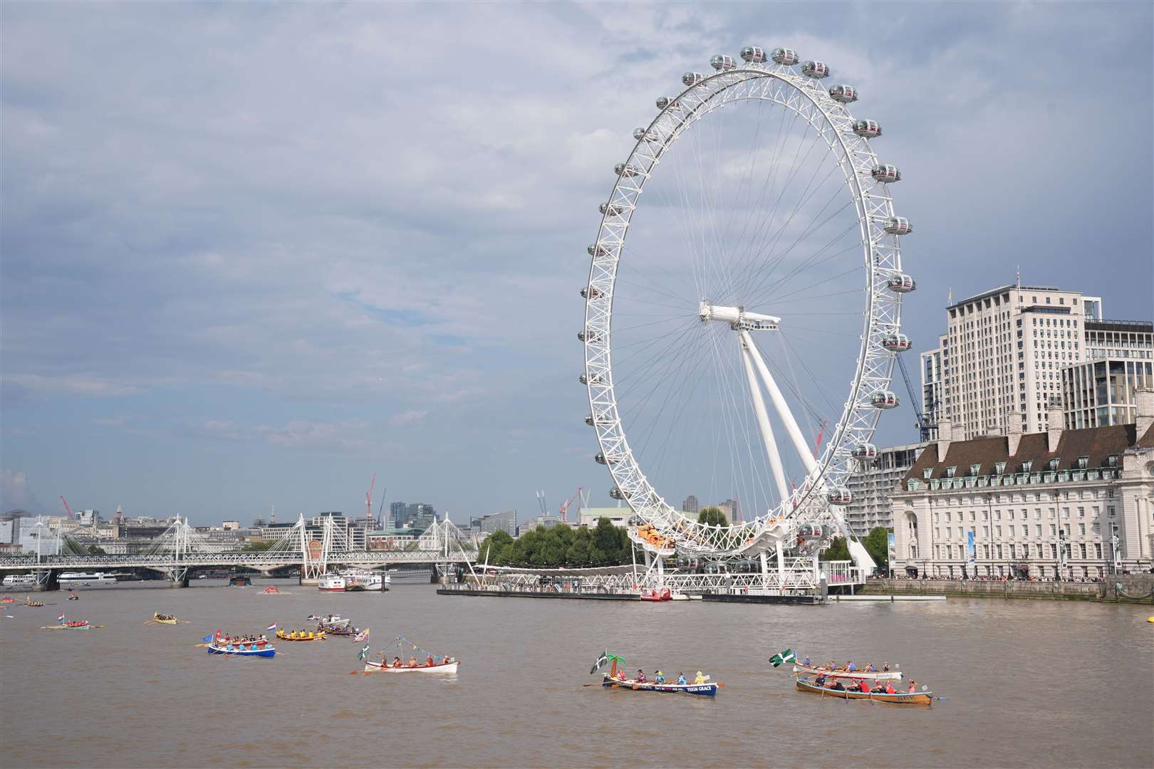 Boats pass the London Eye (Lucy North/PA)