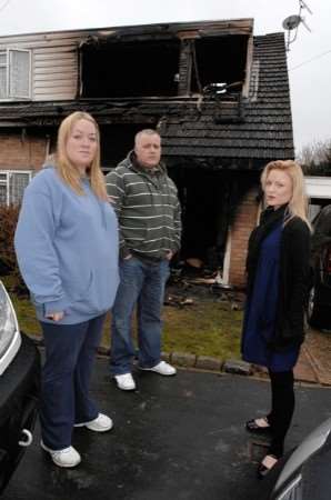 Laura Jefferson, right, with her sister Sarah-Jo Vane and brother-in-law Anthony outside the house