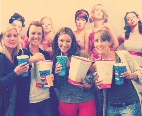 Kelly Brook posing with friends at the Odeon cinema in Chatham Maritime.