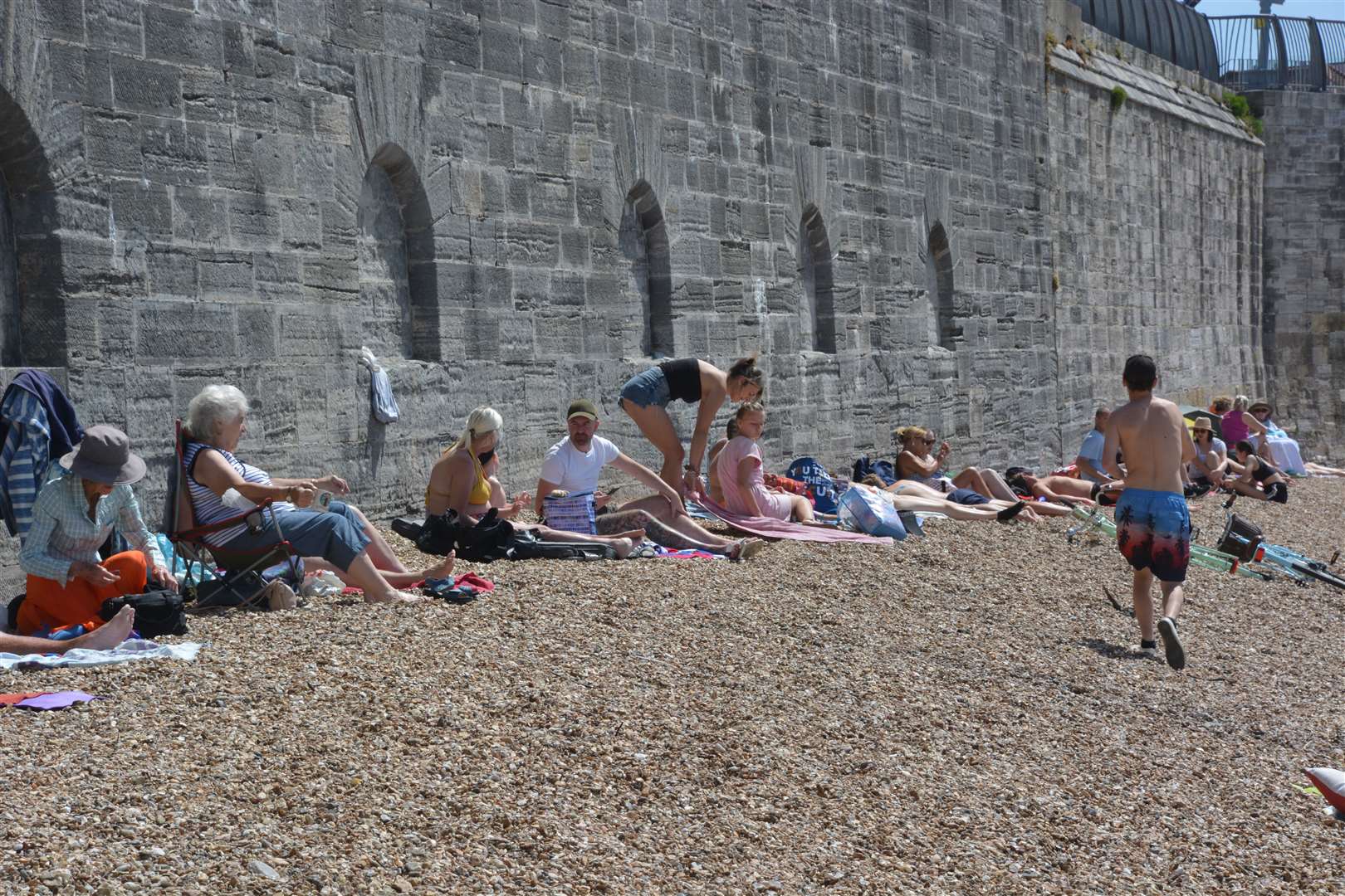 People enjoying the sun at Hot Walls beach, Old Portsmouth, Hampshire (Ben Mitchell/PA)