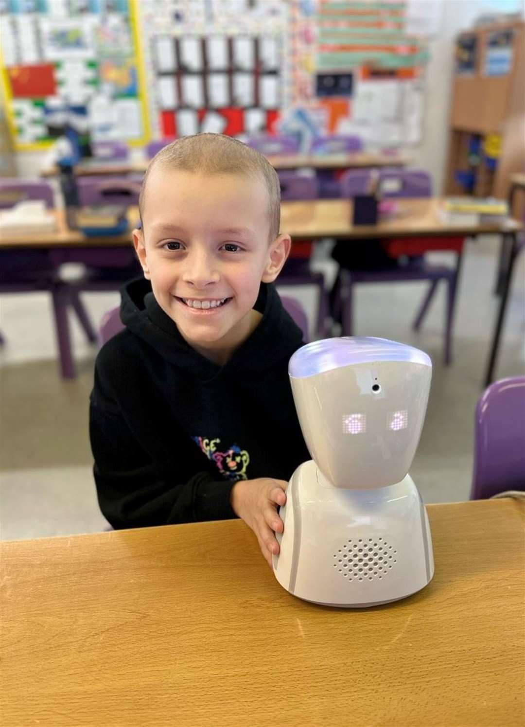 Leo Elliott with his robot at school. Picture: The Chartwell Children's Cancer Trust