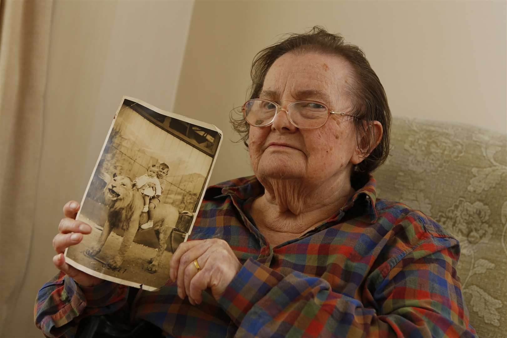 Pictured is Betty Crouch with a photograph of her late husband Gordon Crouch and brother Alec at Maidstone Zoo in 1936