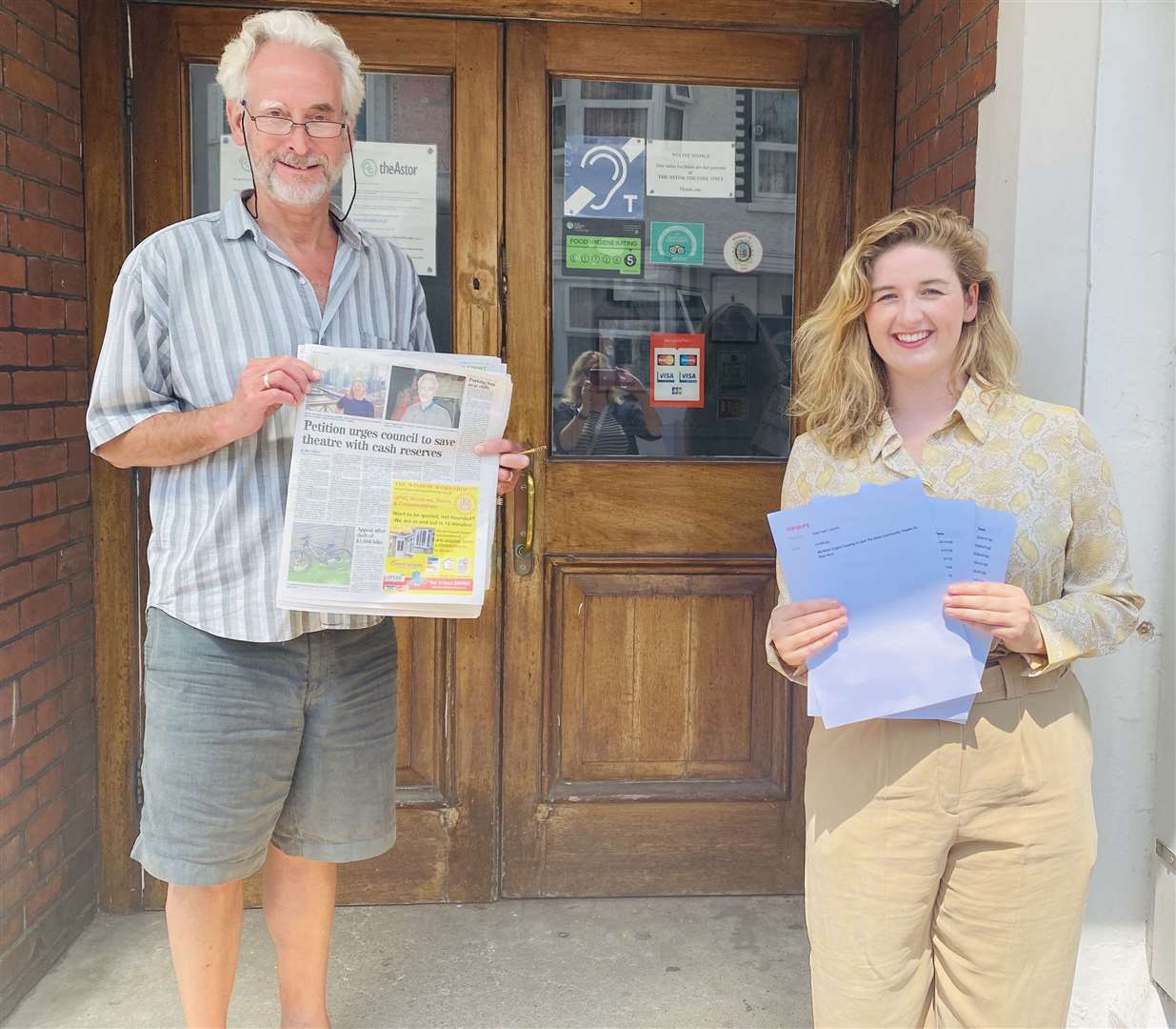 Amber Bytheway with Astor Theatre creative director James Tillitt with the petition asking the council to support the venue