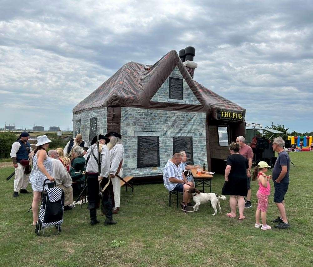 Villagers enjoy a drink at the inflatable pub