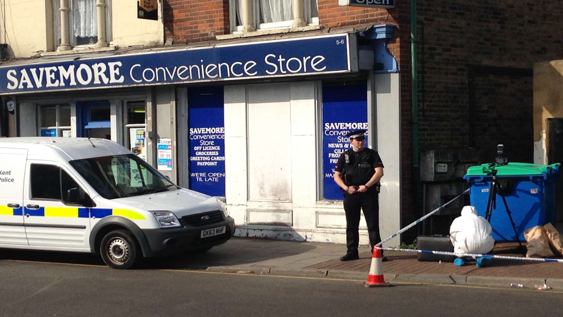 A policeman stands guard outside the cordoned-off area in The Hill, Northfleet