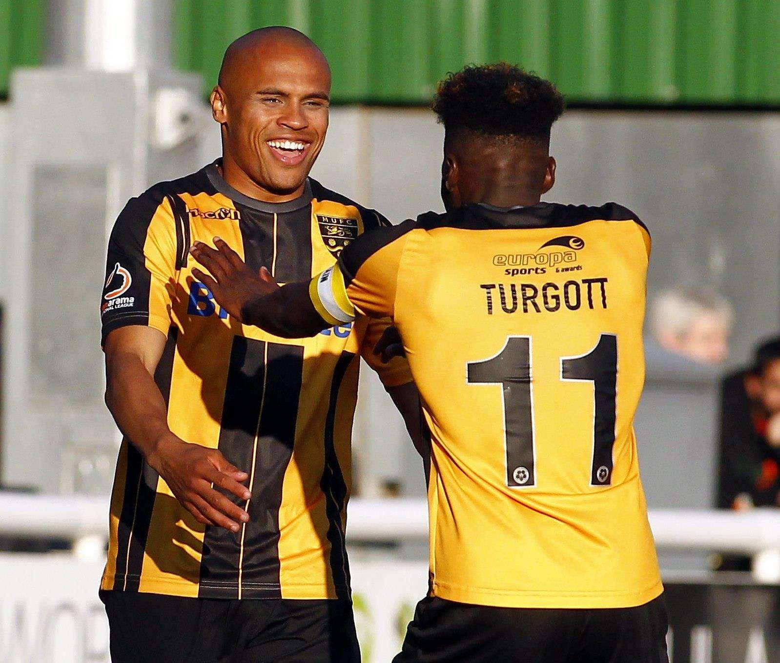 Elliott Romain celebrates his debut goal with Blair Turgott Picture: Sean Aidan