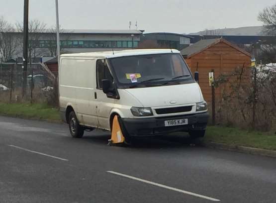 The white Transit has been parked up on the kerb, just ahead of a bend, for more than a week.