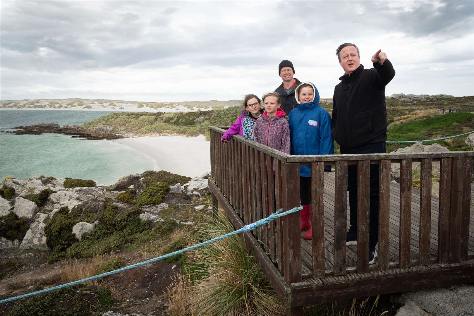 Foreign Secretary Lord David Cameron meets local school children at Gypsy Cove on the Falkland Islands (Stefan Rousseau/PA)