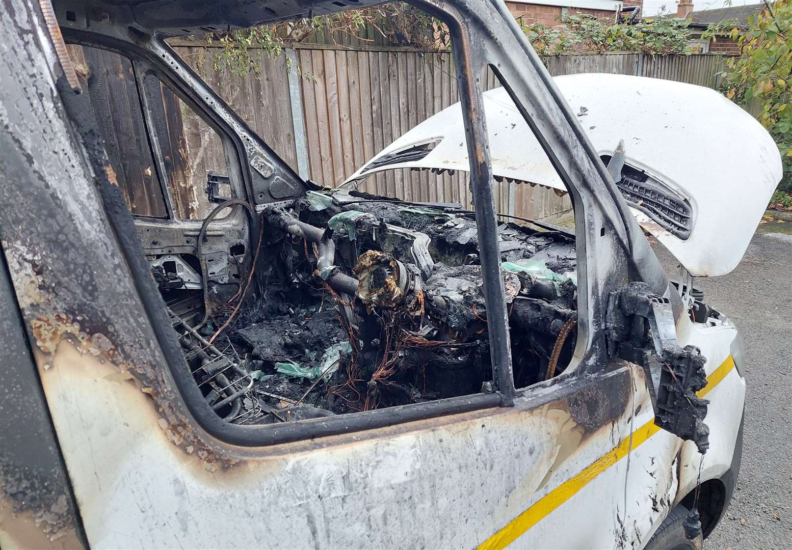 The flames spread to a fence next to the van