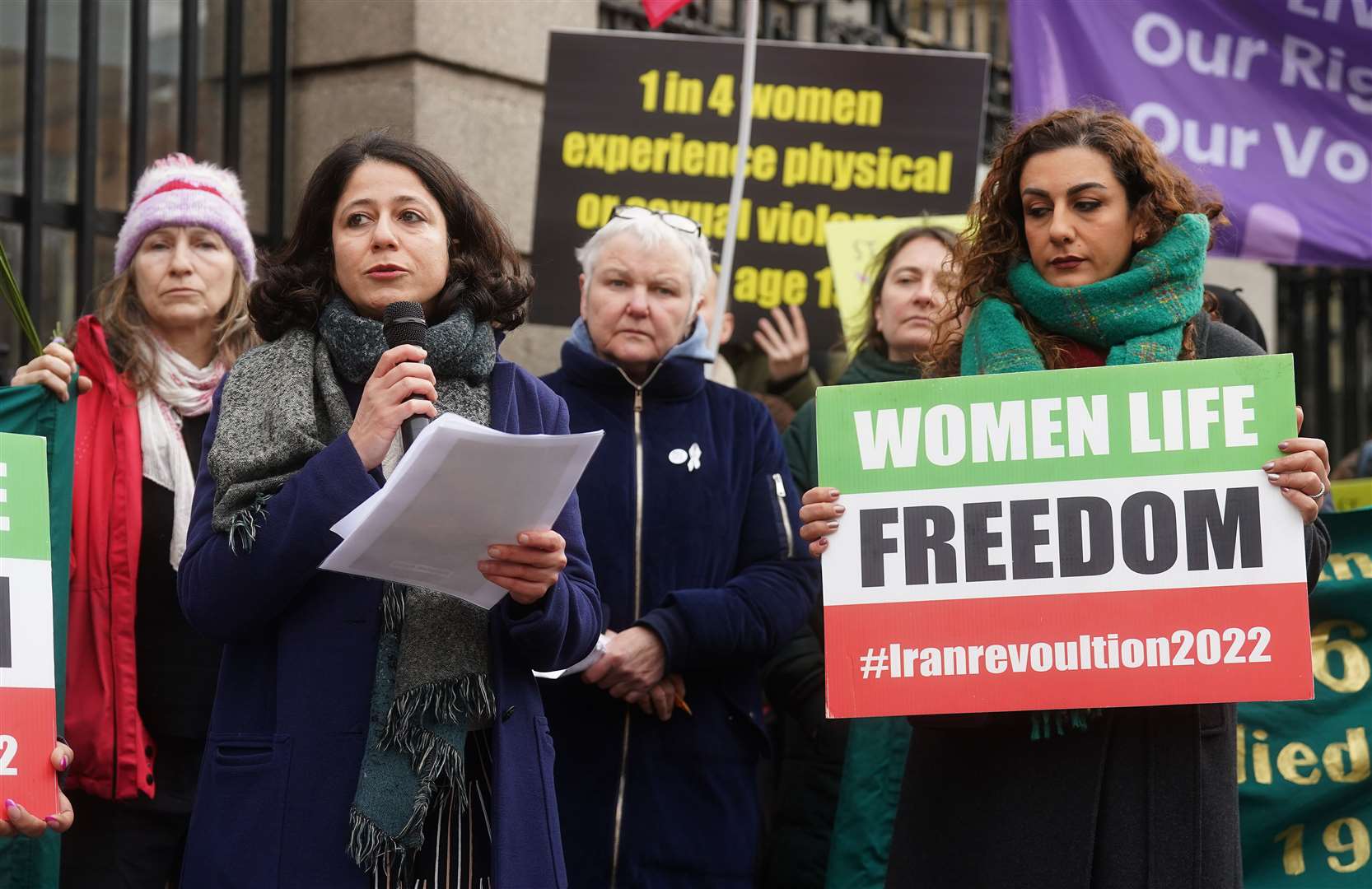 Roja Fazaeli (second left), an associate professor in Islamic civilisations at Trinity, speaking at a St Brigid’s Day rally outside Leinster House. (Brian Lawless/PA)