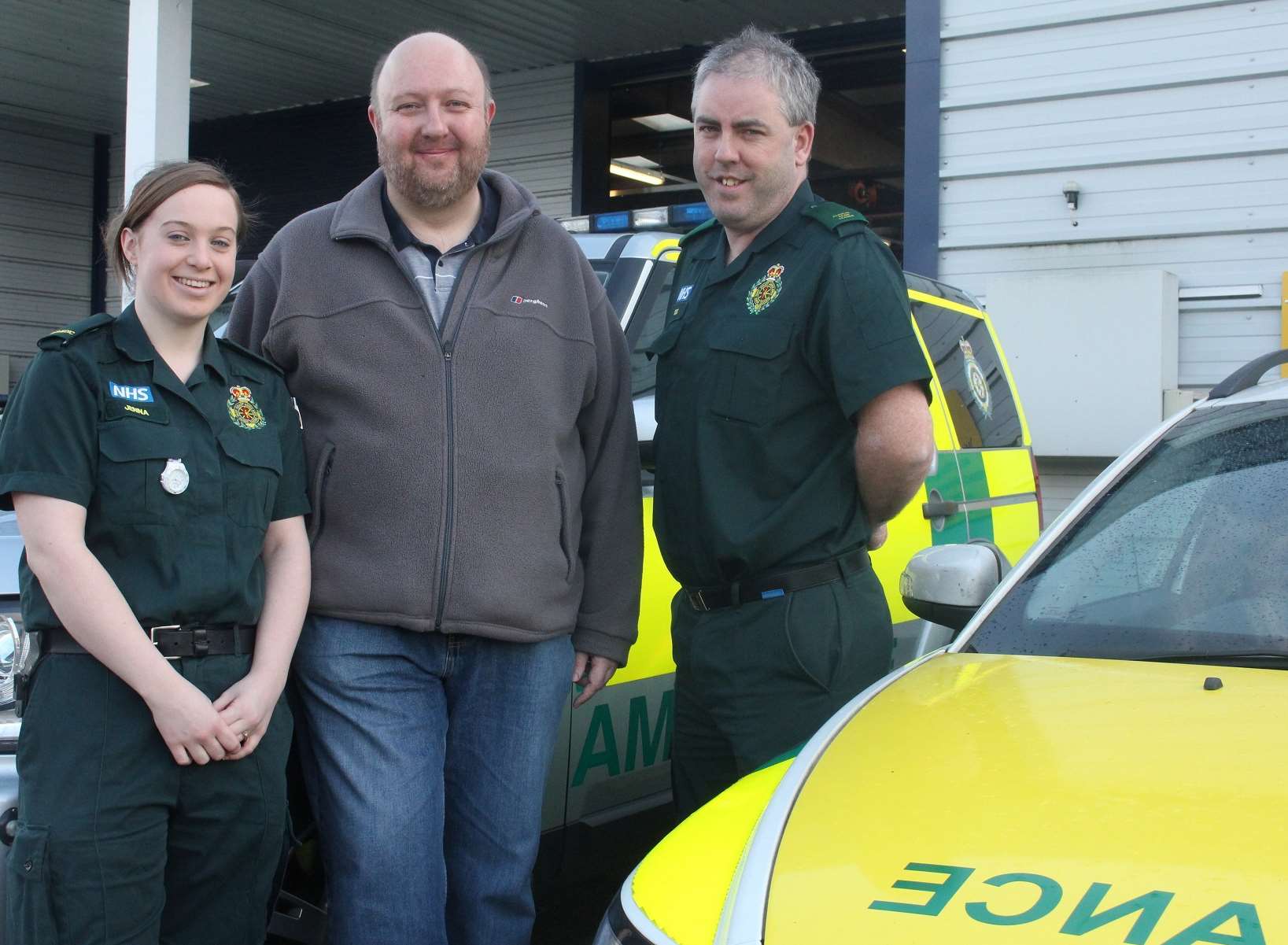 Paramedics Jenna Wyatt and Des Lacey with, centre, Scott Montgomery