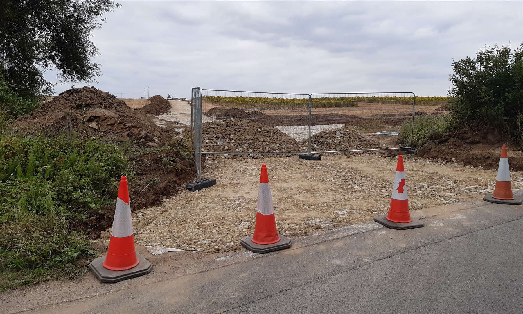 Part of a hedge has been removed to make a temporary access point