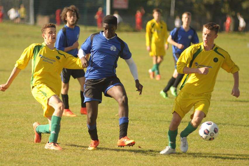 Omega 92, in blue, outnumbered by Cliffe Woods Colts in Under-18 Division 3 Picture: Steve Crispe