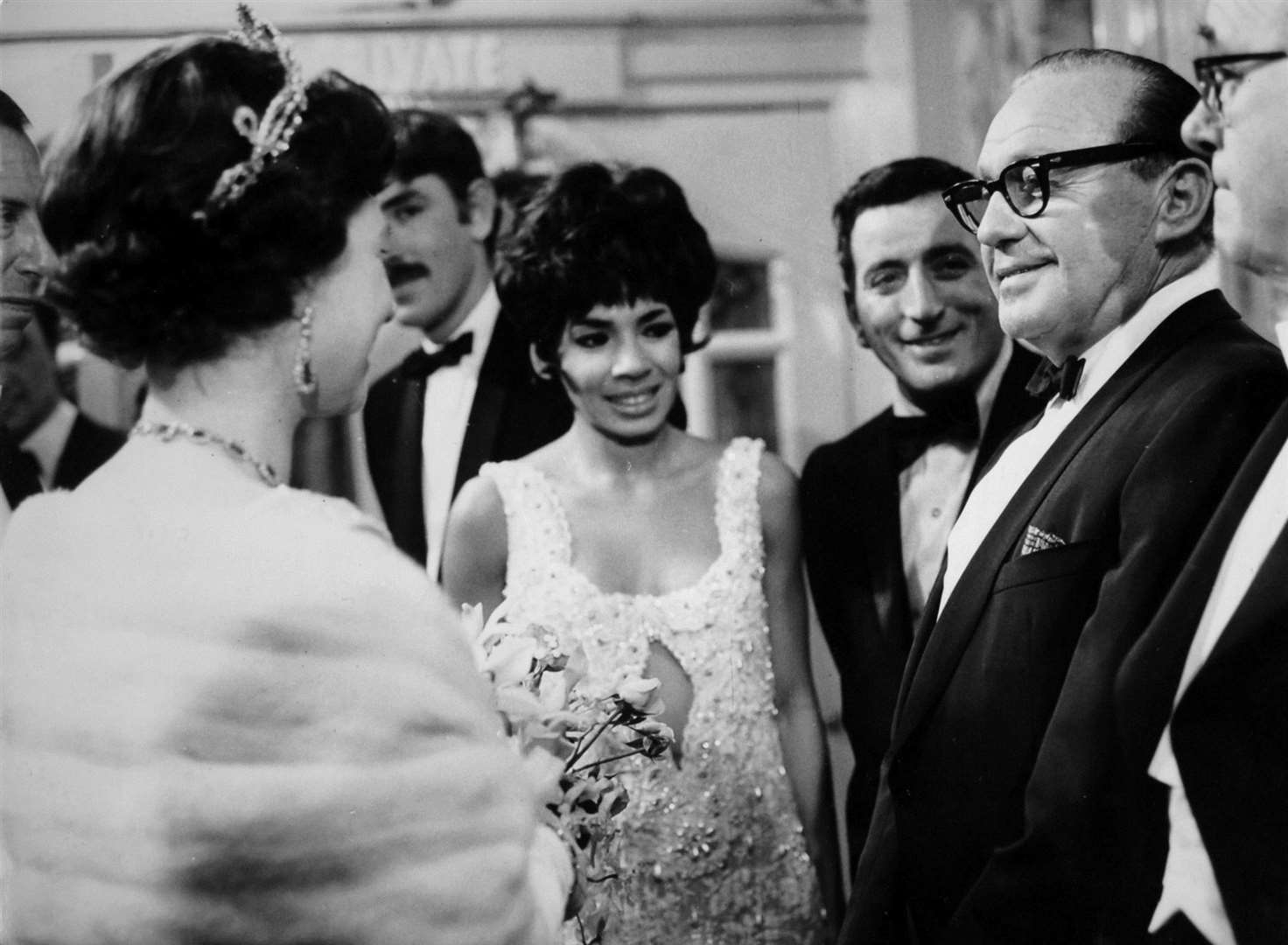 The then Queen talking with Americans Jack Benny and Tony Bennett and Britain’s Shirley Bassey in 1965 (PA)