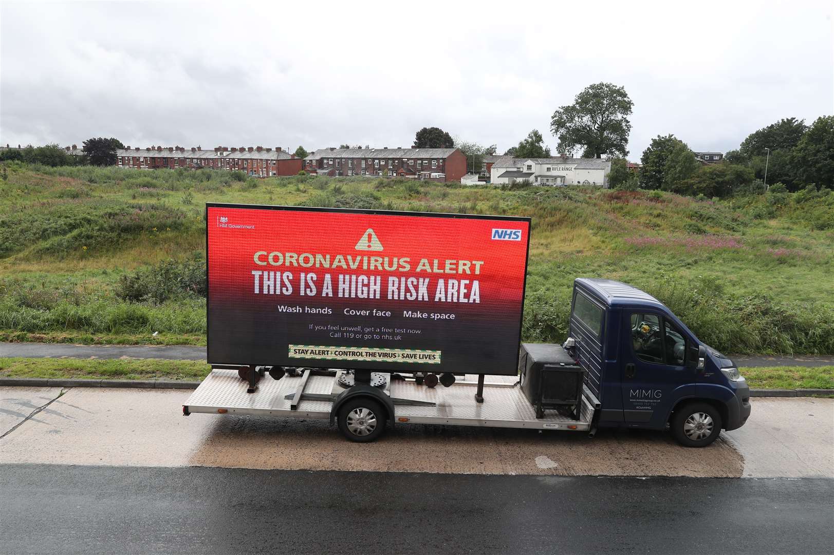 A mobile advertising vehicle displaying a coronavirus high risk area warning in Oldham (Peter Byrne/PA)