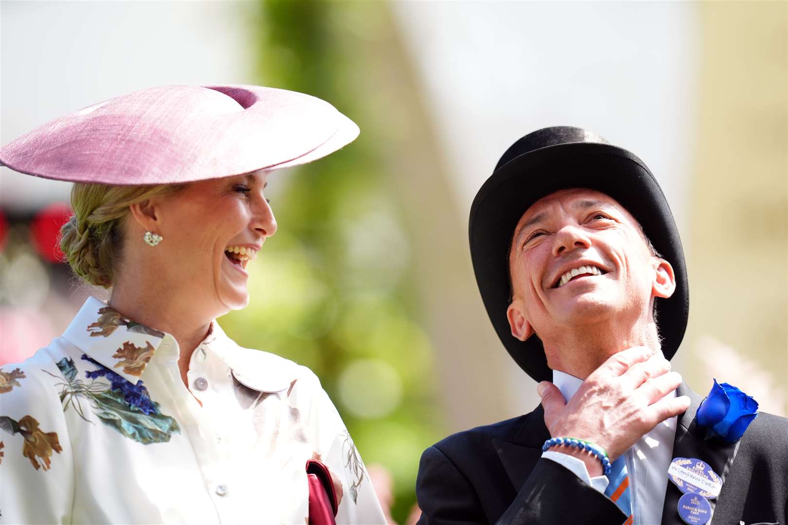 The Duchess of Edinburgh shares a laugh with jockey Frankie Dettori (John Walton/PA)