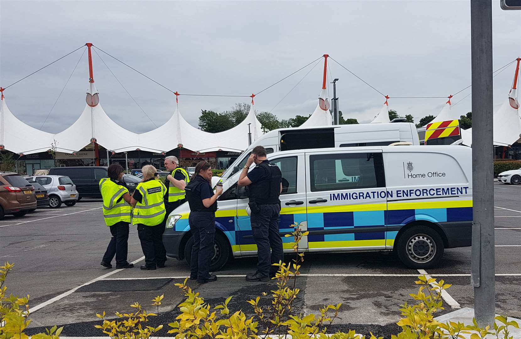 Three Home Office vehicles are currently stationed in the Ashford Designer Outlet car park (13604277)