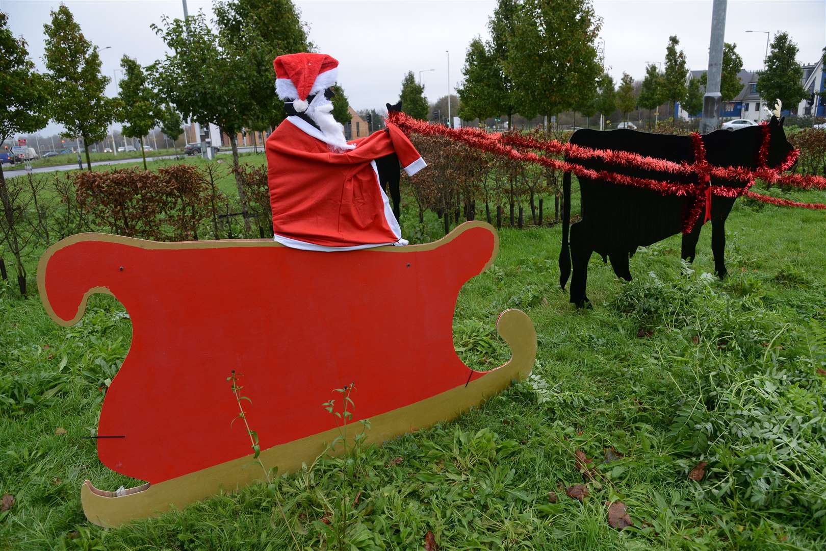 The inventive friends decorated the roundabout's inhabitants overnight