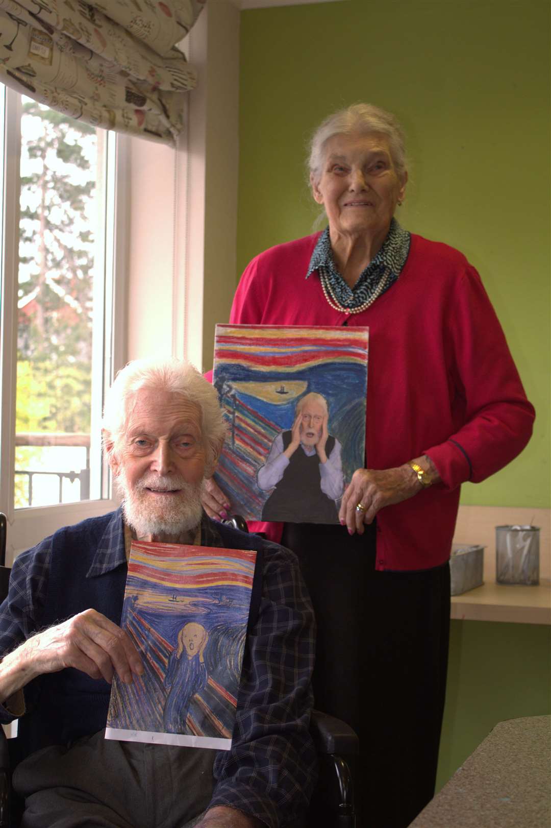 Residents pose with their recreations of Edvard Munch’s The Scream (Care UK/PA)