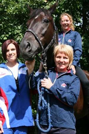 Cheryl Garland, Emma Reynolds, on Murphy, and Louise Ayley ready for the firefighter world games. Picture: Kent Fire & Rescue Service