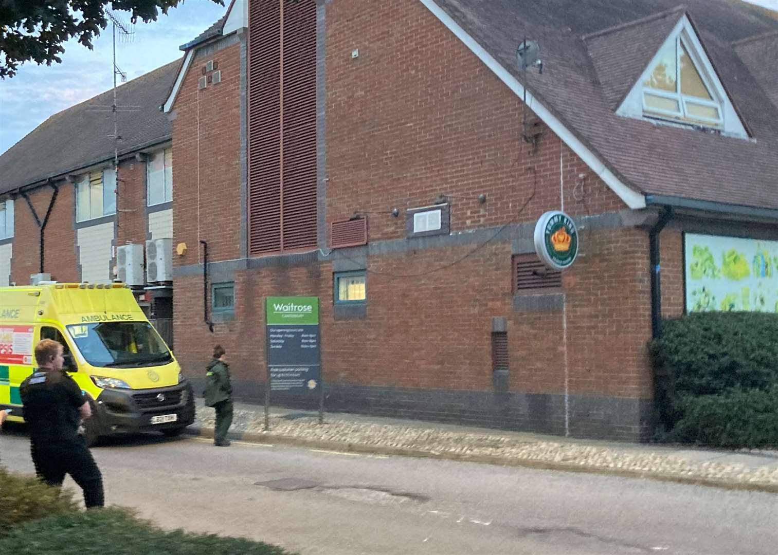 One of the police officers present, with an ambulance, at the scene behind Waitrose in Canterbury