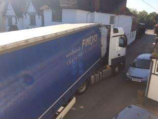 The lorry wedged up against the pub. (1876331)