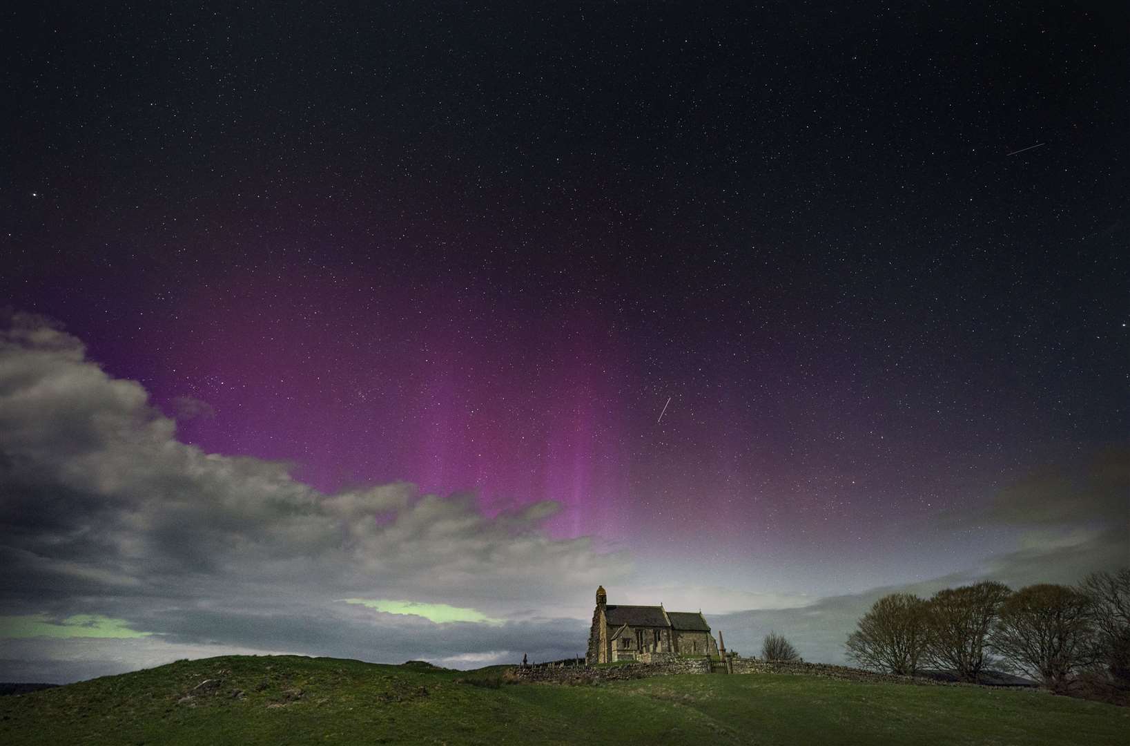 The Northern Lights illuminate the sky in Northumberland (Owen Humphreys/PA)