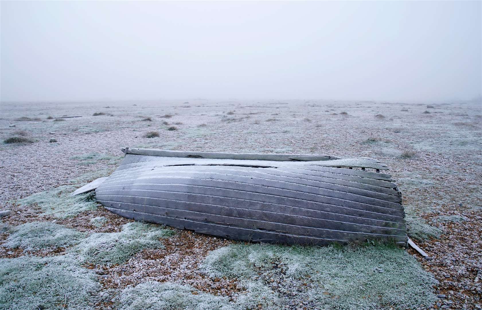 A disused boat on a frozen beach in Dungeness, Kent (Gareth Fuller/PA)