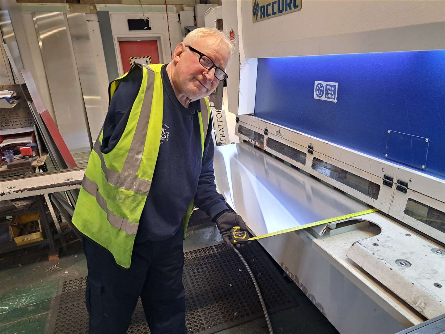 One-armed veteran Colin Pavey working in the signage section