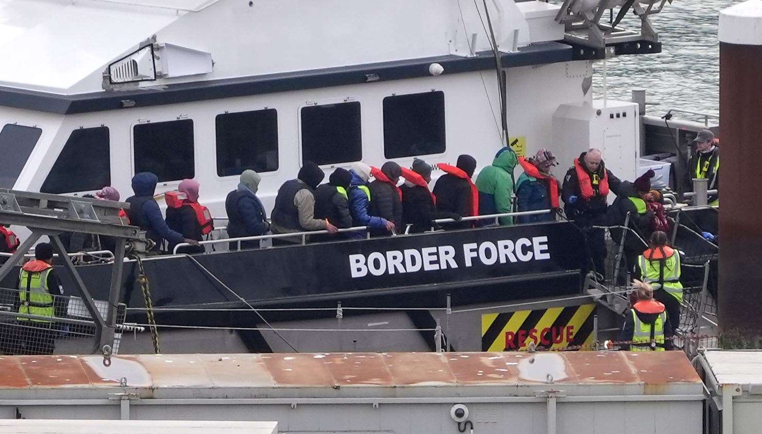 A group of people thought to be migrants are brought in to Dover from a Border Force vessel (Gareth Fuller/PA)