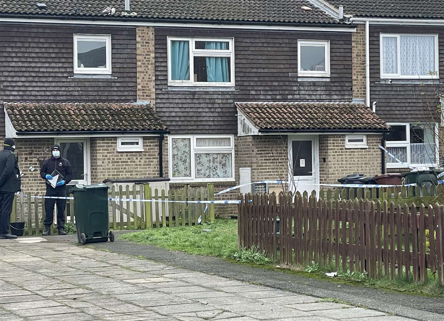 Officers outside the home on Friday