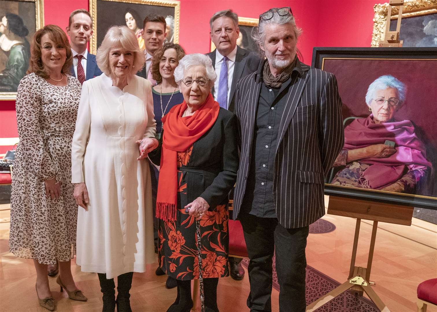 The Duchess of Cornwall with Holocaust survivor Helen Aronson (centre) and her family, and artist Paul Benney (right) beside Helen’s portrait (Arthur Edwards/The Sun)