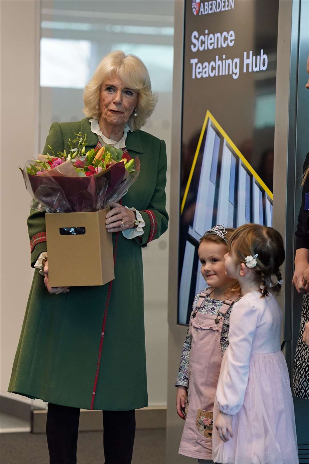 Camilla was presented with flowers by youngsters Elspeth Cameron, left, and Rosa Alexander (Andrew Milligan/PA)