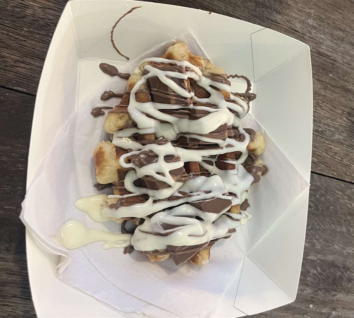 This waffle covered in white chocolate sauce and Kinder pieces was an indulgent addition